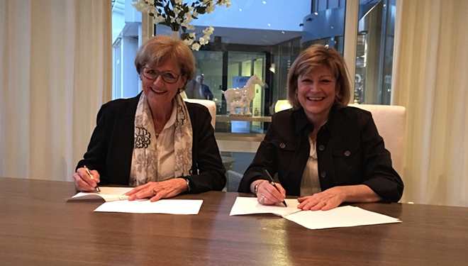  Radboudumc Board Member Cathy van Beek and Saint Elizabeth CEO Shirlee Sharkey recognize our collaboration at Our Future Health in the Netherlands. 